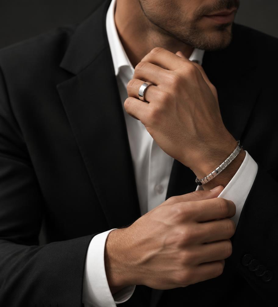 Man wearing a platinum ring and bracelet